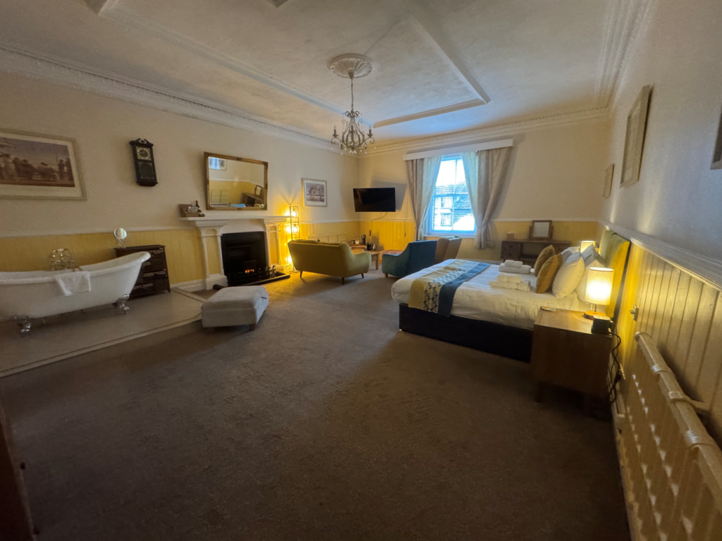 Room 5 at the Red Lion, Cromer. Former billiard room with a freestanding bath and walk-in shower
